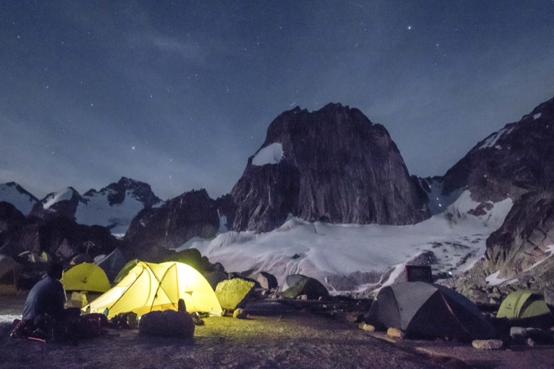 Climbers' camp at night beneath granite spires, Bugaboos, British Columbia
