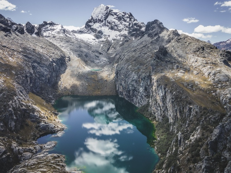 Turquoise alpine lake beneath a glaciated peak, Cordillera Blanca, Peru